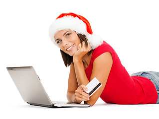 Image showing woman in santa hat with laptop and credit card