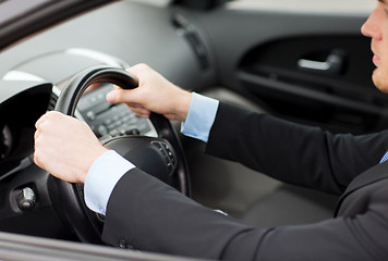 Image showing businessman driving a car