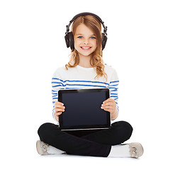 Image showing child with headphones showing tablet pc