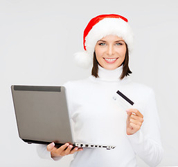 Image showing woman in santa hat with laptop and credit card