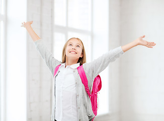 Image showing student girl with hands up at school