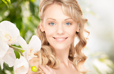 Image showing beautiful woman with orchid flower