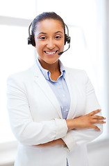 Image showing african helpline operator with headphones