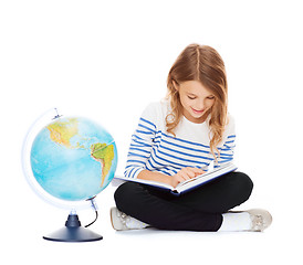 Image showing girl with globe and book