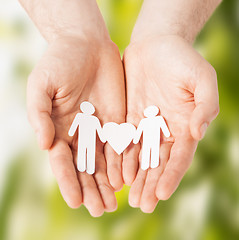 Image showing man hands with paper men