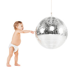 Image showing toddler playing with disco ball