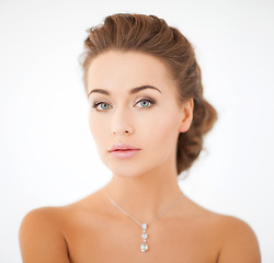 Image showing woman wearing shiny diamond pendant