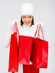 Image showing picture of happy woman with shopping bags
