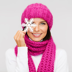 Image showing woman in hat and muffler with big snowflake