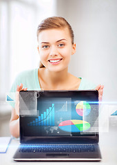 Image showing businesswoman showing laptop with graph