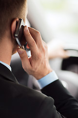 Image showing man using phone while driving the car