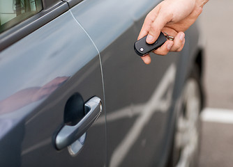 Image showing man with car key outside