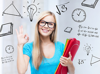 Image showing smiling student with folders