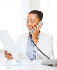 Image showing african businesswoman with phone in office