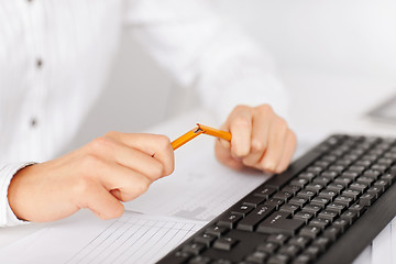 Image showing woman breaking pencil