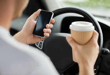 Image showing man using phone while driving the car