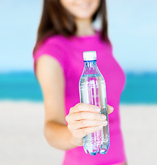 Image showing sporty woman with bottle of water