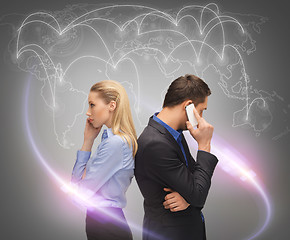 Image showing man and woman calling with smartphones