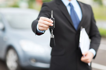 Image showing man with car key outside