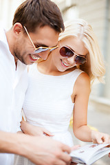 Image showing couple with tourist book in the city