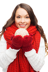 Image showing woman in scarf and mittens with christmas ball