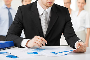 Image showing businessman working with papers