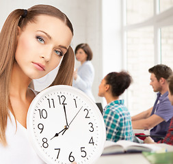 Image showing student showing clock