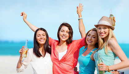 Image showing girls with drinks on the beach