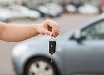 Image showing man with car key outside