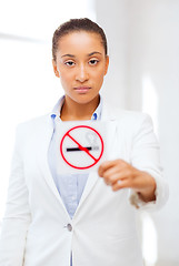 Image showing african woman with restriction no smoking sign