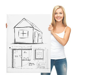 Image showing woman holding picture with house