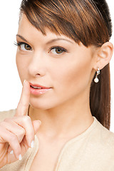 Image showing woman with finger on her lips