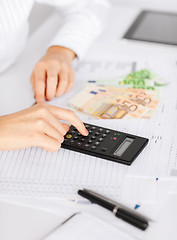 Image showing woman hand with calculator and euro money