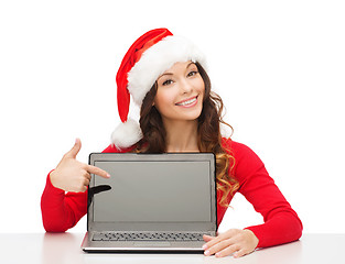 Image showing woman in santa helper hat with laptop computer