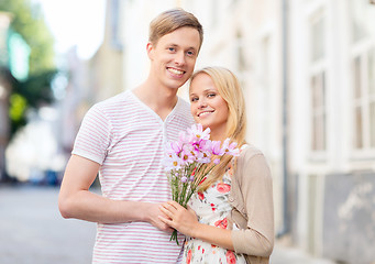 Image showing couple with flowers in the city