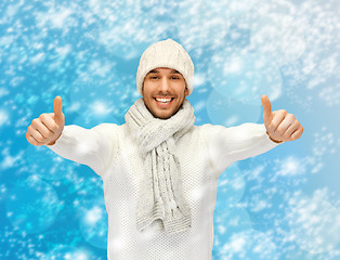 Image showing handsome man in warm sweater, hat and scarf