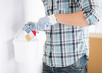 Image showing man with paintbrush and pot