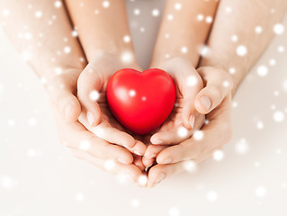 Image showing woman and man hands with heart