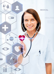 Image showing female doctor with stethoscope and virtual screen