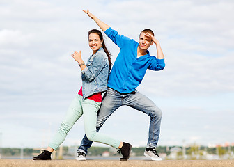 Image showing couple of teenagers dancing outside