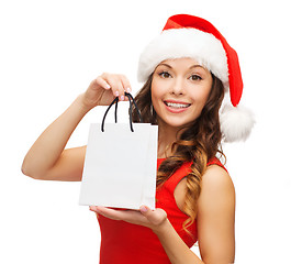 Image showing woman in red dress with shopping bag