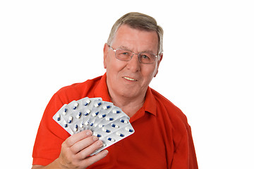 Image showing Senior man holding medicaments