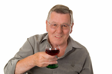 Image showing Old man drinking red wine