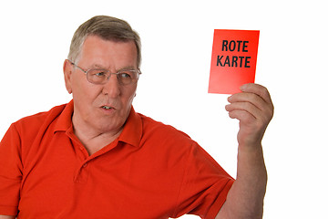 Image showing Old man showing red card