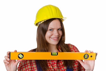 Image showing Craftswoman with hardhat and water level