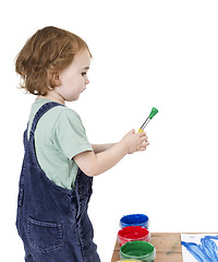 Image showing child with brush and green paint