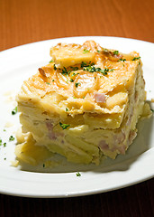 Image showing Czech Republic food specialty baked sliced potato  smoked bacon 