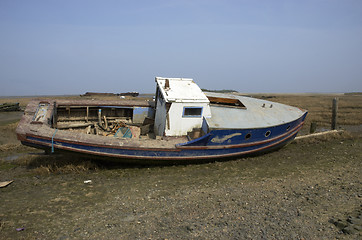 Image showing Small boat in the mud