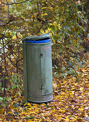 Image showing autumn scenery with rubbish bin