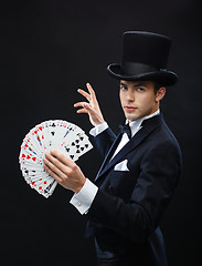 Image showing magician showing trick with playing cards